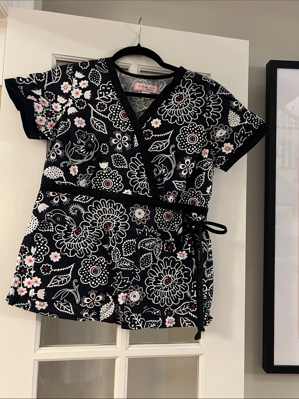 Koi Black Floral Wrap Scrub Top with Red Accents